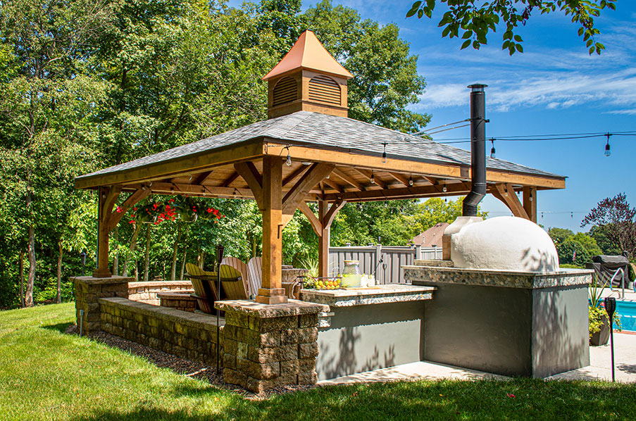 timber frame pavilion sheltering pizza oven