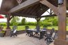 impressive timber frame pavilion with outdoor furniture